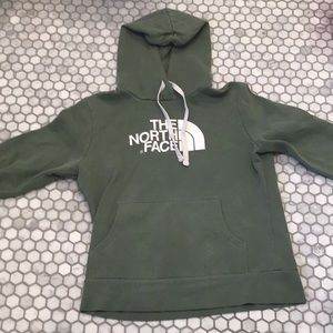 Green north face hoodie with a white North face logo on the front two jaw straps